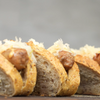 Reuben Flavored Bratwurst Seasoning, brats in buns with sauerkraut