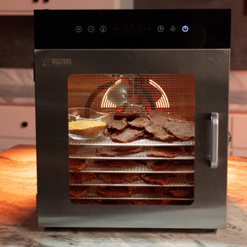A lifestyle shot of Jerky being made in an dehydrator