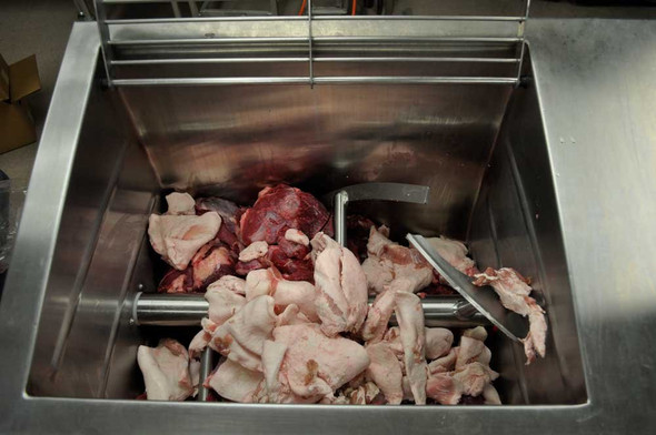 Meat being mixed in a Hall 60 Mixer Grinder
