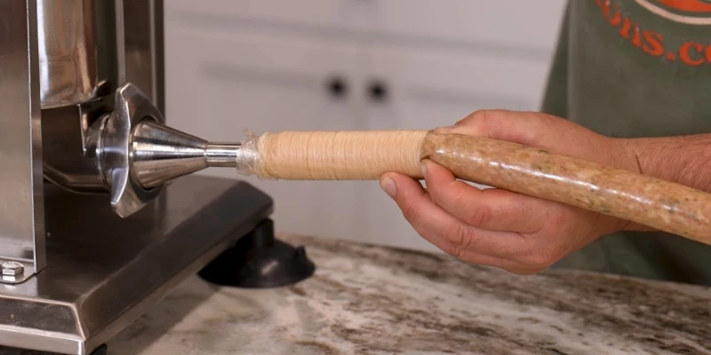 casings loaded on a sausage stuffer