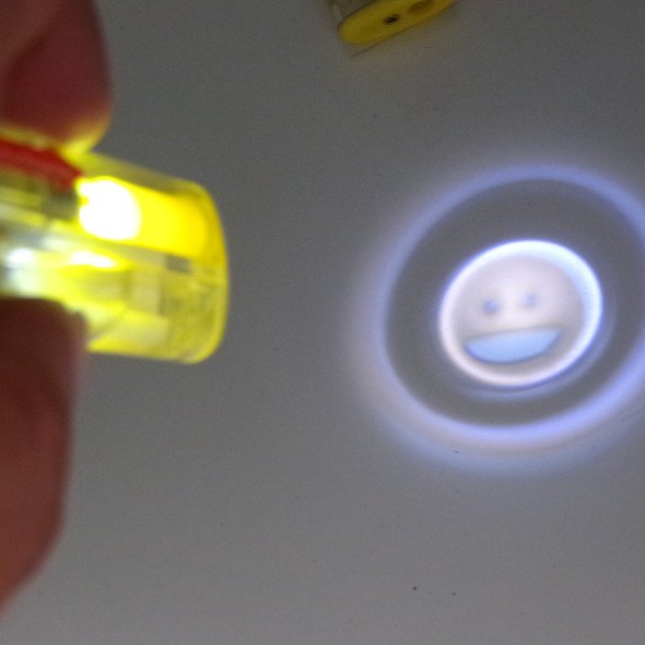 Set of Two Happy Face Emoji Projecting Refillable Lighters