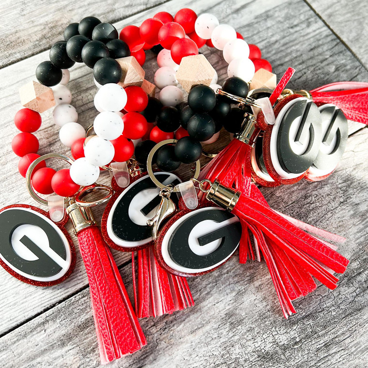 RED BLACK AND WHITE WRISTLET - RED TASSEL