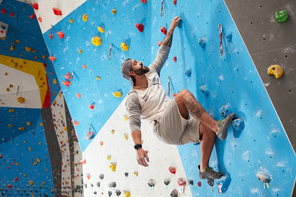 Climber wearing tactical smart watch 