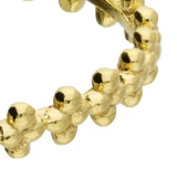 Close-up of a gold-plated beaded silver ring with polished texture.