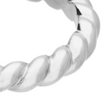 Close-up of twisted sterling silver ring with open adjustable design.