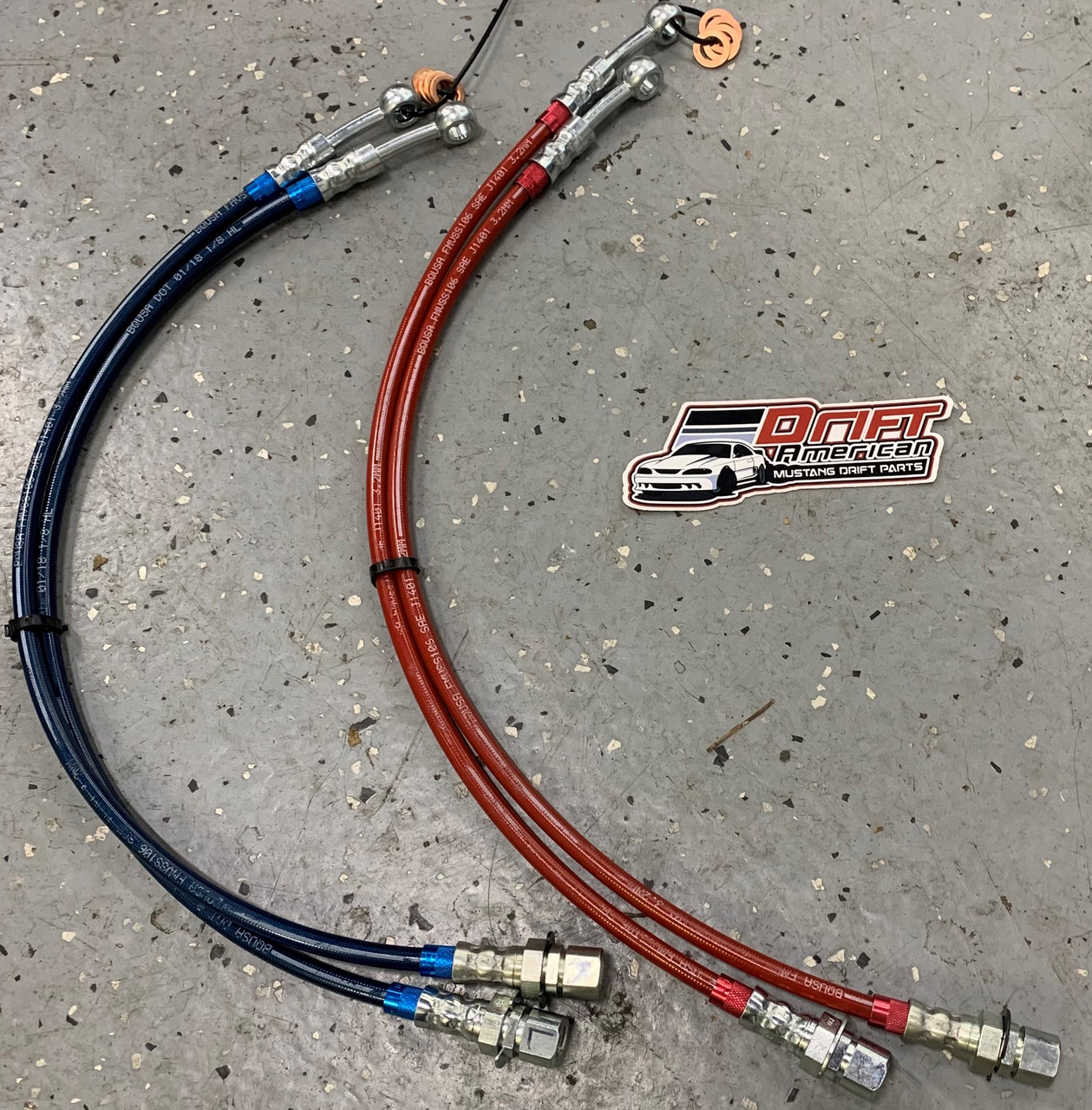 Drift American Extended Length Steel Braided Brake Lines for Ford Mustang shown in blue and red.