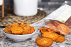 Range from bright orange to amber-orange, with black sun spots on the skin, typical of persimmons