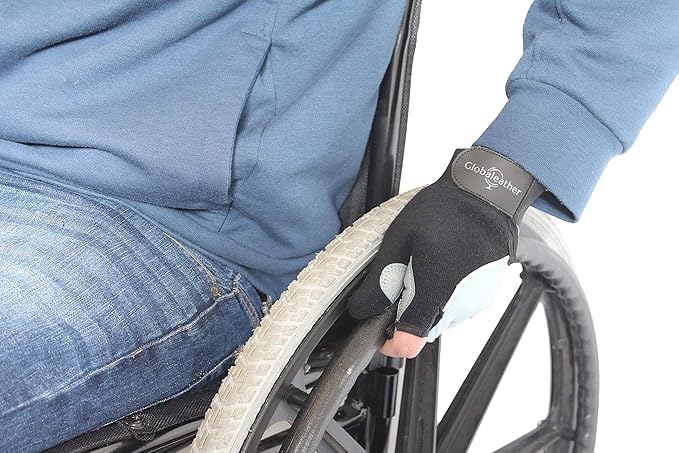 Person in a wheelchair putting on padded gloves.