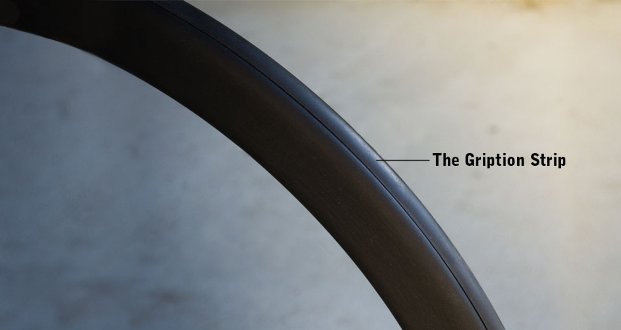 The Gription Stripã¢ is a rubber strip that goes all the way around the top surface of the oval handrim.

The Gription Strip is particularly helpful when going up ramps, hills, or when traversing difficult surfaces (e.g., like deep-pile carpeting). Smooth side surface means no-burn braking.