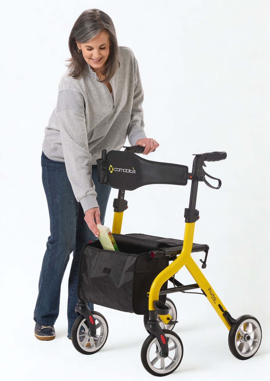 Piuma Ultra-Light Rollator Walker Model Getting a Book from Shopping Bag