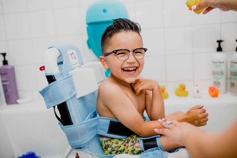 Child using the Otter Bath Chair