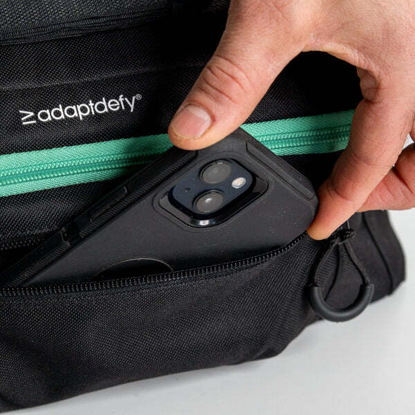 living-spinal-adaptdefy-bag-phone-hand.jpg