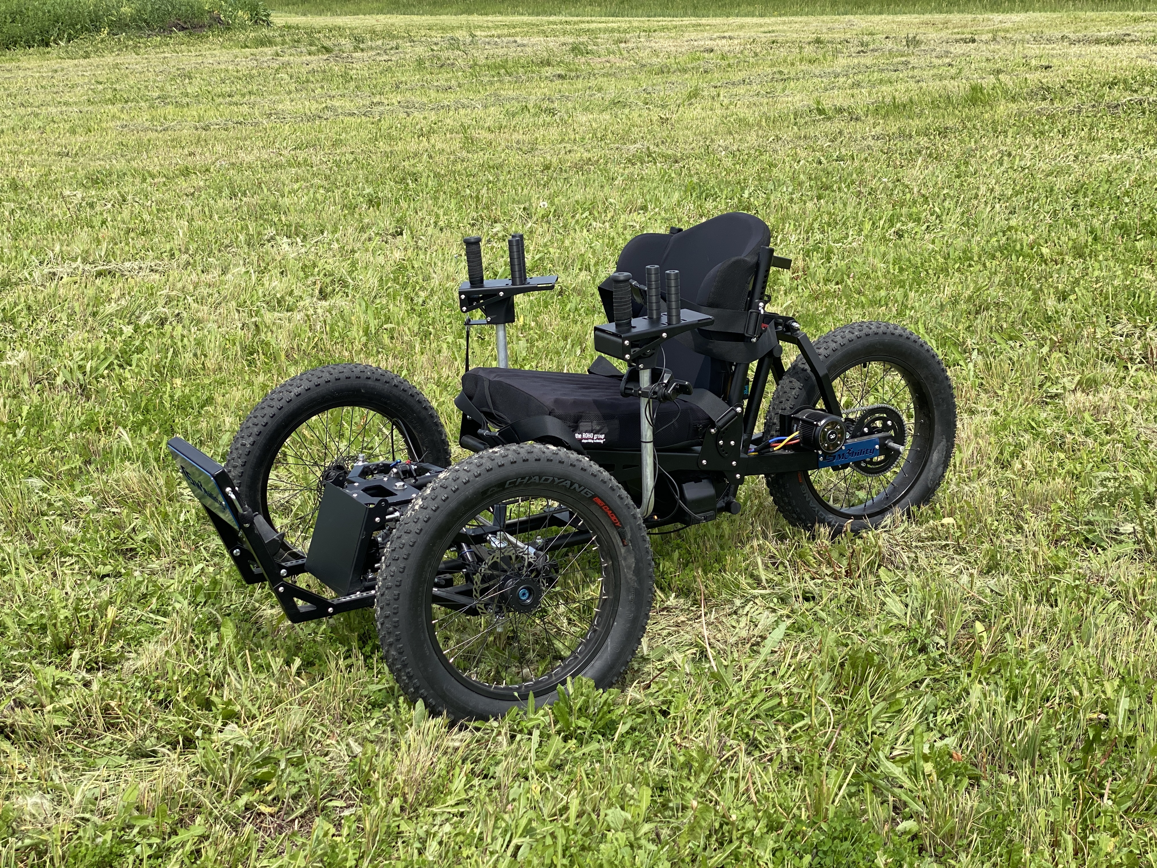 Angled view of the Liberty Rover Off-Road Electric Wheelchair, suitable for trails.
