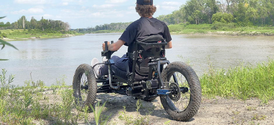 Liberty Rover Off-Road Electric Wheelchair on an outdoor dirt path.