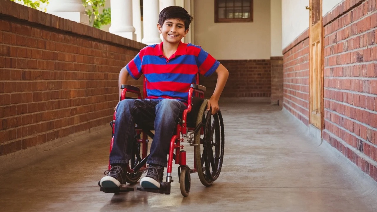 Smiling boy in a wheelchair
