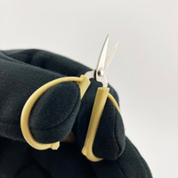 Elongated finger holes fit thin gloves