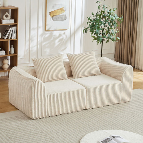 Minimalist Sofa With Curved Lines And Horn Shaped Throw Pillows