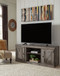 Wynnlow - TV Stand With Faux Firebrick Fireplace Insert - Gray