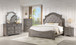 Mikasa four-piece bedroom set in antique gray, full set view with bed, dresser, mirror, and nightstand