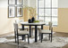 Xandrum - White / Black - 5 Pc. - Round Dining Room Table, 4 Side Chairs