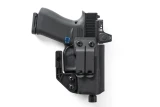 Black Kydex IWB holster upright, belt clip side shown with claw wing and holstered pistol with optic