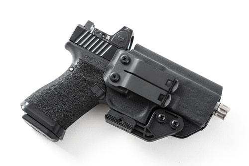 Black Kydex IWB holster for Glock 19X with red dot pistol, angled view showing belt clip and claw