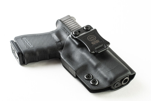 Black Kydex IWB holster for Glock 31, angled rear view with logo belt clip and holstered pistol