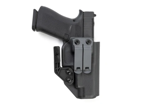 Rear view of black Kydex IWB holster with Glock 48 MOS, dual gray belt clips and claw attachment