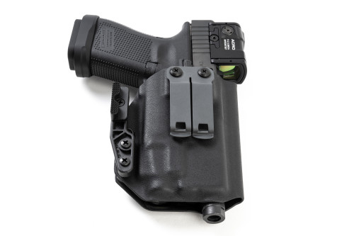 Black Kydex IWB holster for Glock 19 with weapon light, back view showing dual clips and claw
