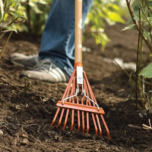 Narrow Shrub Rake close-up in mulch