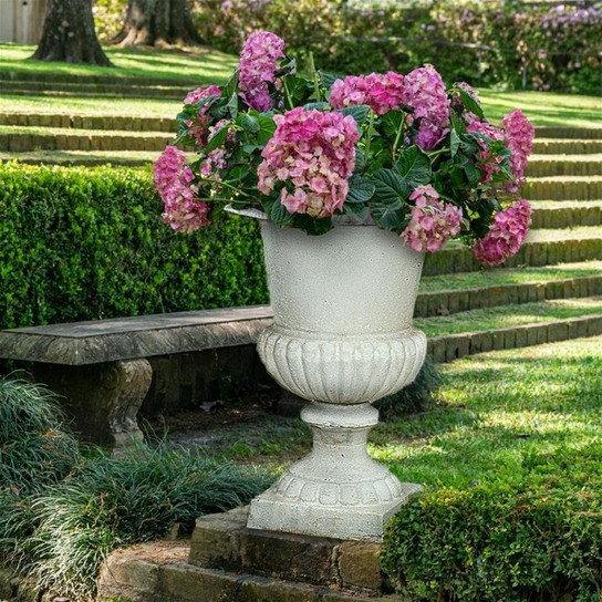 Chateau Elaine Authentic Iron Urn Planter in the Garden