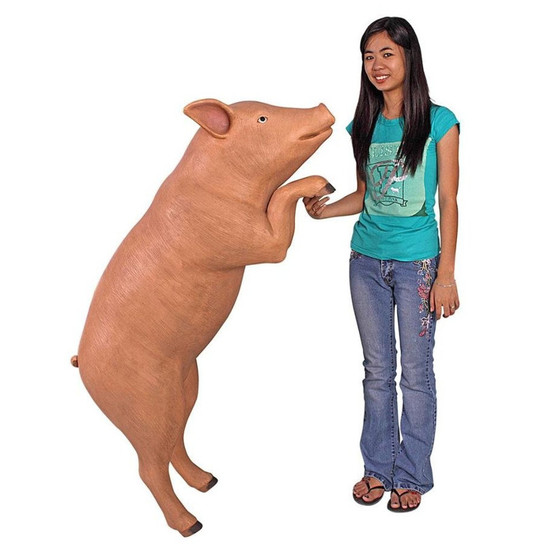 Hop Over Hog Giant Pig Animal Statue next to Gardener