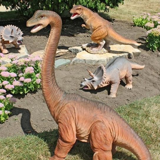 Scaled Jurassic Dinosaur Statues in the Garden