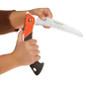Saw folding pruning saw in hand
