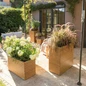 PALO Natural Eucalyptus Wood Planters on the Patio