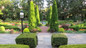 Garden Path to Water Fountain with Emerald Green Arborvitae