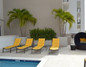 Montroy Cube Planters By the Pool With Palm Trees