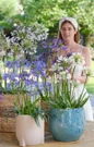Woman arranging colorful Agapanthus flowers
