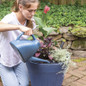 TruDrop Flex Self-Watering Inserts girl watering