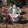 Angel Bearing Gifts Garden Statue in the Garden