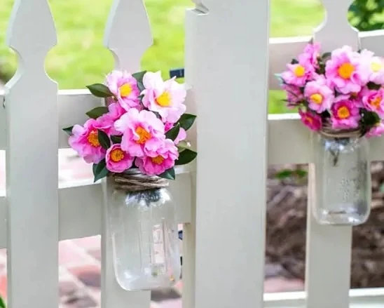 Cut camellia flowers arranged in mason jars