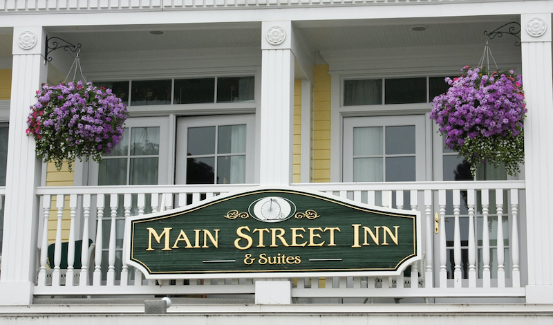 mixed-hanging-baskets-of-annuals-in-front-of-business.jpg