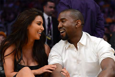 Kim Kardashian and Kanye West at a basketball game