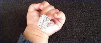 Baby North holding Kim Kardashian's Engagement Ring