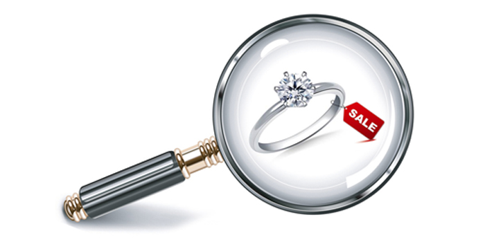 Magnifying Glass looking at a Jewelry Sale