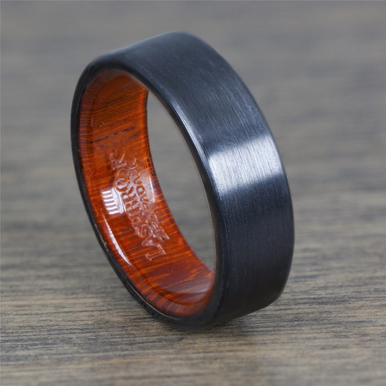 Black Zirconium Ring with a Honduras Redheart Wooden Sleeve by