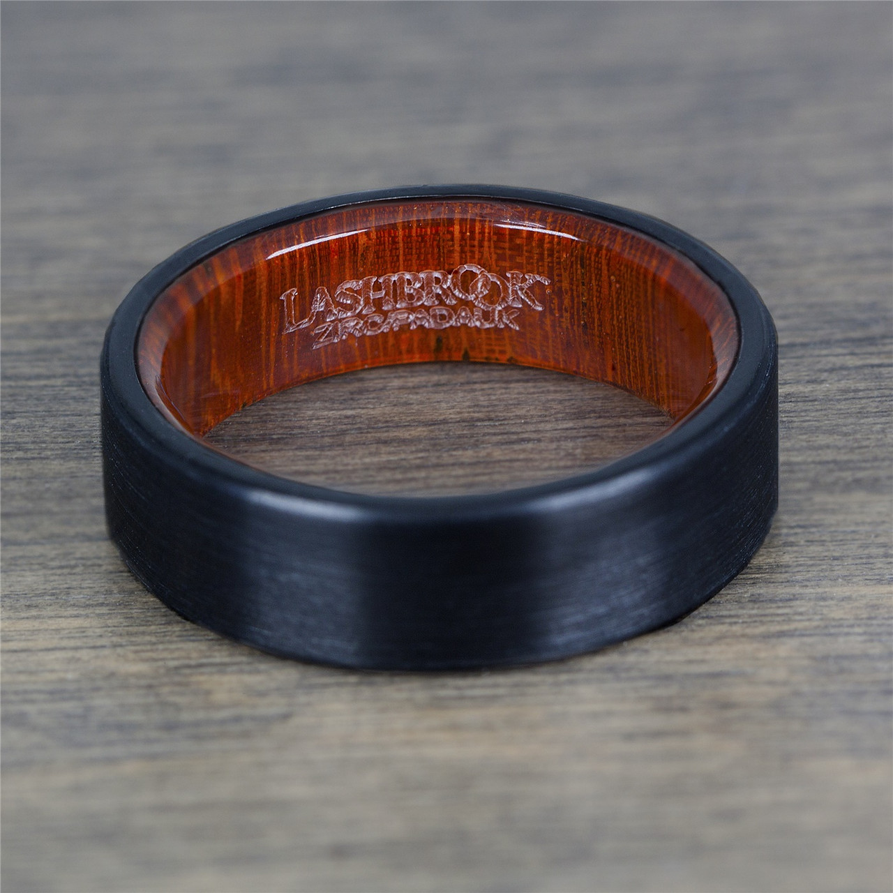 Black Zirconium Ring with a Honduras Redheart Wooden Sleeve by