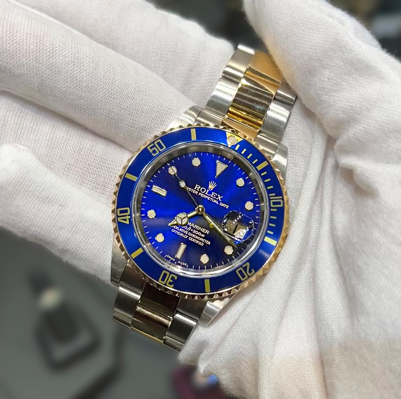 Rolex Submariner Two-Tone with Blue and Bezel, and tags.