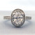 18K Oval Diamond Engagement Ring With Halo .64ctw