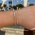 14K Yellow & White Gold .61ctw Diamond Bezel Set Bypass Wire Texture Flex Bangle Bracelet